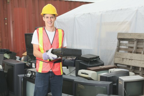 Waste collection trucks servicing a commercial area